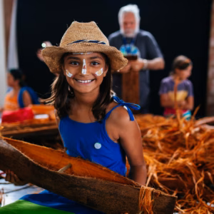a little girl dancing with a big smile on her face